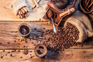 Barista preparing a fresh cup of coffee with espresso machine in a café
